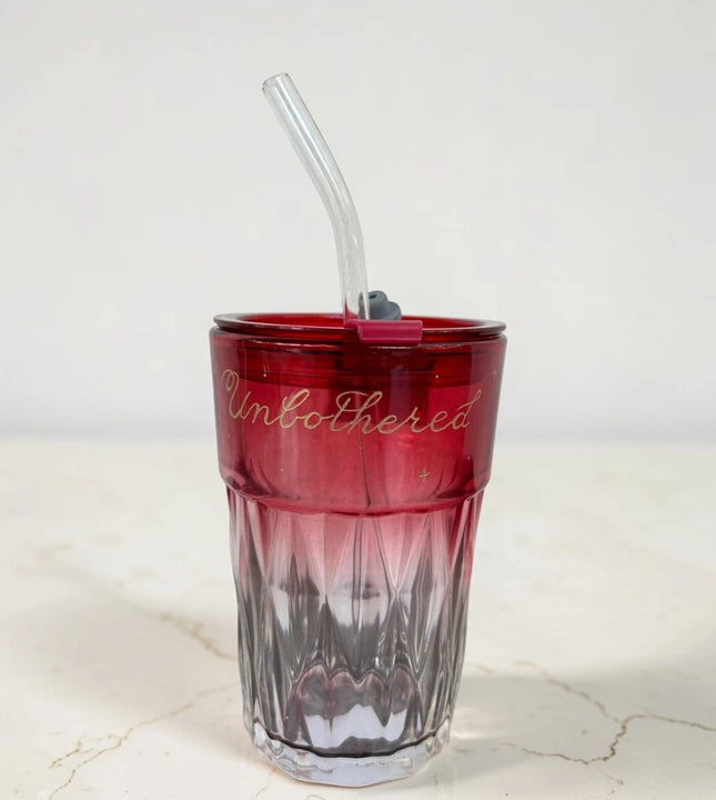 Red glass sipper cup with straw and custom lettering Unbothered by Ekeha