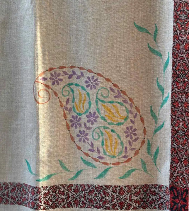 Close up of hand painted paisley and floral artwork on handcrafted shawl