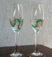 Elegant hand painted champagne glasses with gold floral design – premium glassware for weddings and gifting