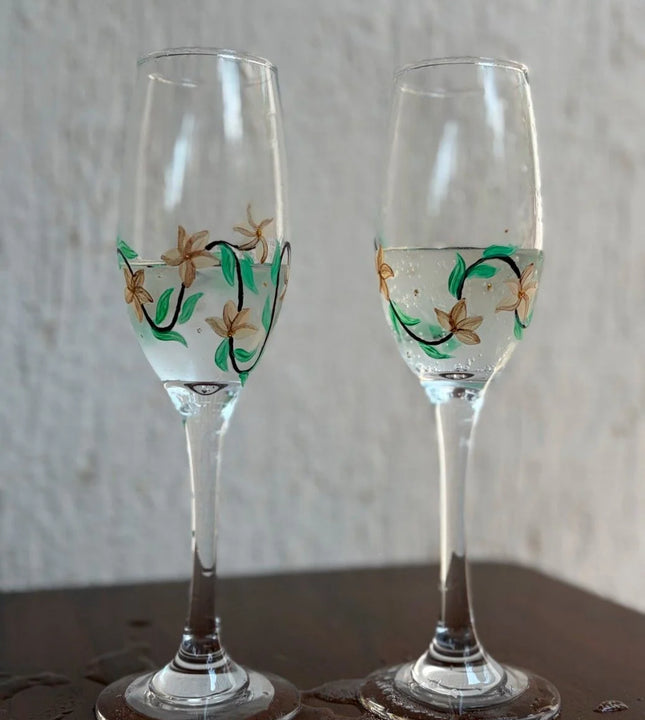 Elegant hand painted champagne glasses with gold floral design – premium glassware for weddings and gifting